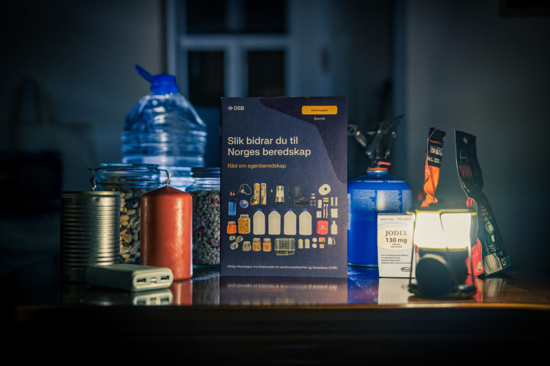 Self-preparedness brochure with water, dry food, camping lantern, candles and battery bank