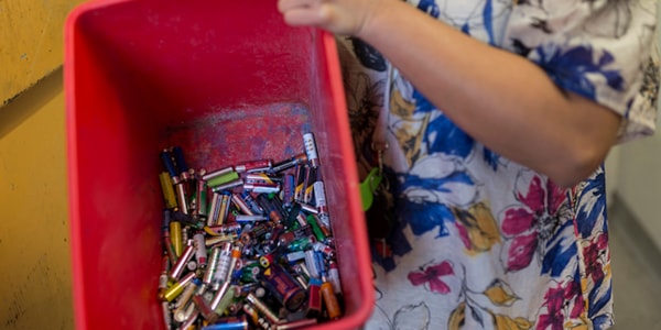 Plastic tray with used batteries