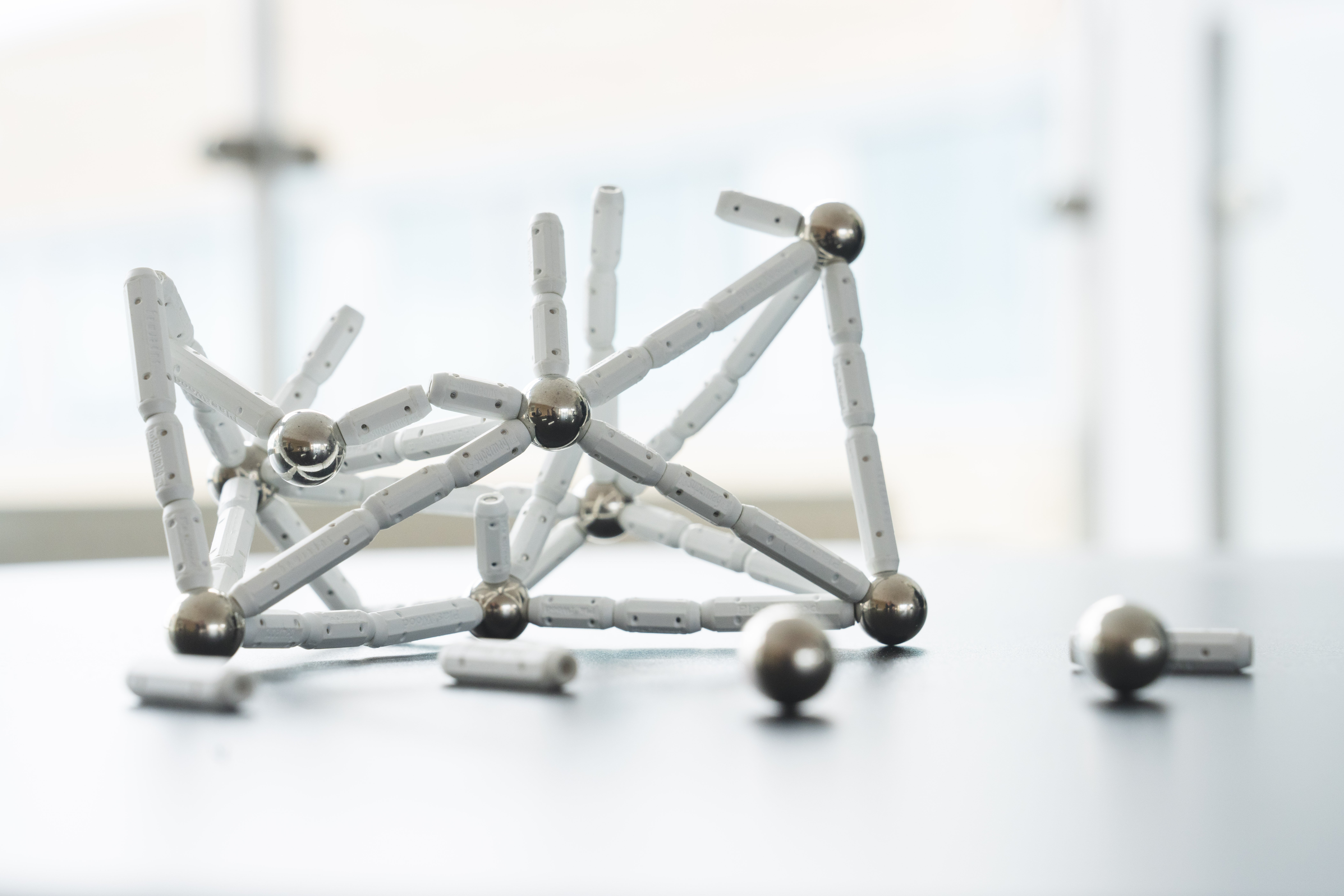 Small magnetic balls with magnetic pins in between.